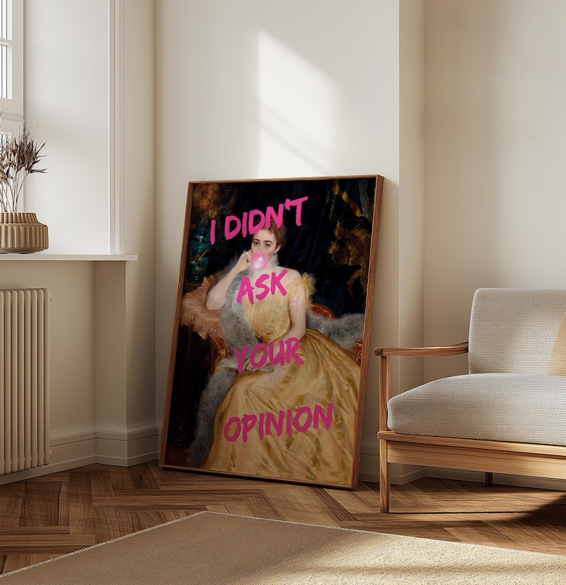 May include: A vintage portrait of a woman with a pink bubble gum in her mouth. The text "I DIDN'T ASK YOUR OPINION" is written in pink over the image.