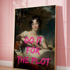 May include: Framed print featuring a classical portrait of a woman with a dog, overlaid with the pink text "DO IT FOR THE PLOT." The artwork has a gold frame and is displayed against a pink wall.