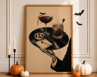 May include: A framed wall art print depicting a skeleton hand in a black suit sleeve holding a black vinyl record as a tray. On the record are a cocktail glass with a bat garnish, a glass with an orange slice, a bowl of eyeballs, and a napkin.