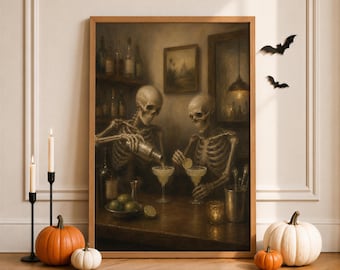 May include: A framed wall art print depicting two skeletons in a dimly lit bar setting. One skeleton pours a drink from a shaker into a glass while the other garnishes a cocktail with a lime slice. The scene features shelves of bottles and warm lighting.