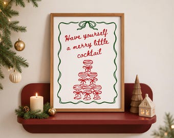 May include: A rectangular framed print with a white background, a green wavy border, and red text that reads Have yourself a merry little cocktail. Below the text is a red illustration of a pyramid of six stemmed cocktail glasses with bows.