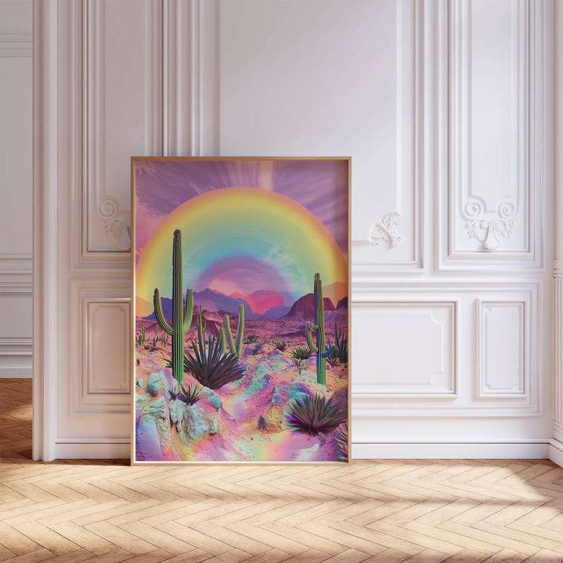 May include: A digital art print featuring a rainbow arching over a desert landscape with cacti and colorful rocks. The background is a vibrant purple and pink gradient.