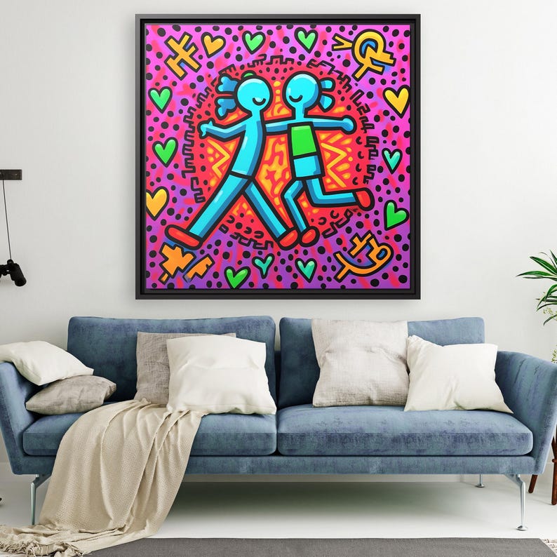 May include: A framed painting of two stick figures walking hand in hand. The figures are blue and green, and the background is pink with black polka dots and hearts. The painting is surrounded by a black frame.