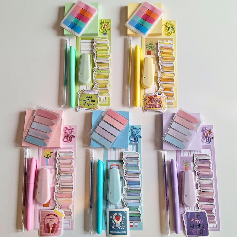 May include: Six sets of stationery supplies, each with a different color theme. Each set includes a notepad, a pack of sticky notes, a pen, a highlighter, and a small decorative sticker. The stickers feature quotes about reading and books.