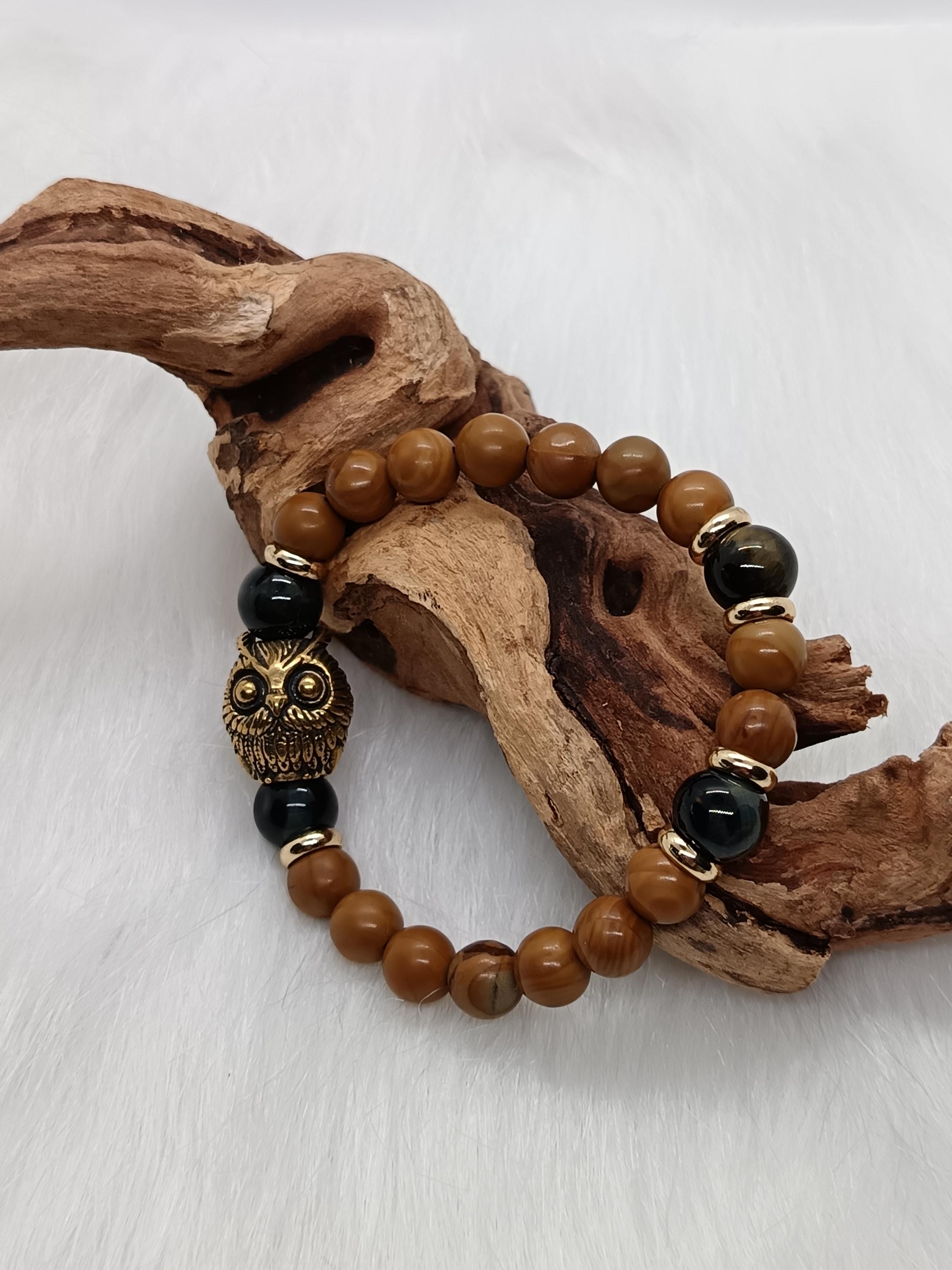 Bracelet "hibou" en bois fossilis&eacute; et &oelig;il de faucon