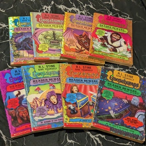 May include: A collection of eight R.L. Stine Give Yourself Goosebumps books with holographic covers. Titles include Escape from the Carnival of Horrors, Tick Tock, You're Dead, Trapped in Bat Wing Hall, The Deadly Experiments of Dr. Eek, and others.