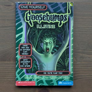 May include: A paperback book titled Give Yourself Goosebumps #30 You're Plant Food! by R.L. Stine. The cover features a green-skinned figure with leaves for hair in a forest setting, with text boxes promoting over 20 scary endings and the Fox Kids show.