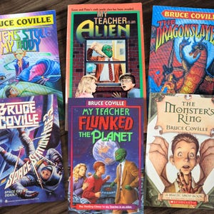 May include: A collection of ten paperback books by Bruce Coville, featuring colorful covers with illustrations of aliens, dragons, monsters, and other fantastical creatures. The titles include "Aliens Stole My Body", "My Teacher is an Alien", "The Dragonslayers", "My Teacher Flunked the Planet", "The Monster's Ring", and "Space Station Danger".