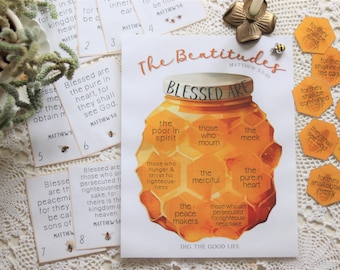 May include: A printable poster with a honey jar illustration depicting the Beatitudes from the Bible. The poster features the text "Blessed Are" and the words "the poor in spirit", "those who mourn", "the meek", "the merciful", "the pure in heart", and "the peacemakers". The poster also includes the text "Matthew 5:3-10" and "Dig the Good Life".