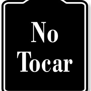 May include: Black and white sign with the text "No tocar" which means "Do not touch" in Spanish.