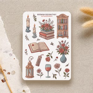 Bookish Romantasy cottagecore sticker sheet featuring pile of books with flowers, open book, lantern, vase with flowers, shelf full of books, single floral stickers, and glass of wine, with dreamy book lover aesthetic.
