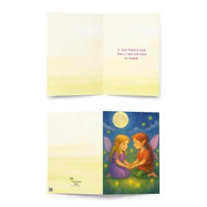 May include: Greeting card featuring an illustration of two fairies holding hands under a full moon. The fairies have blonde and red hair, wearing purple and orange outfits. The card reads, "A true friend is rarer than a fairy and twice as magical."