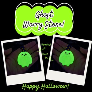 May include: A glow-in-the-dark ghost worry stone featuring a dark blue wizard hat with yellow stars. The text reads Ghost Worry Stone!, Spooky!, Boo!, and Happy Halloween!. The ghost has a rounded shape with a small smiling face and rosy cheeks.
