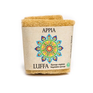 May include: A brown loofah sponge with the text "APPIA" and "LUFFA" printed on the packaging. The packaging also includes a colorful mandala design and the text "100% Natural" and "Éponge végétale / Vegetable sponge".