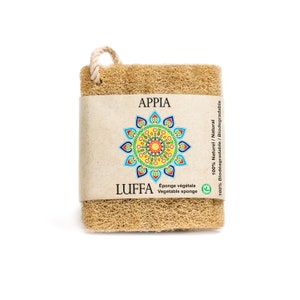 May include: A natural loofah sponge with a brown paper label that reads "APPIA LUFFA Vegetable sponge Éponge végétale 100% Naturel / Natural 100% Biodégradable / Biodegradable". The label features a colourful mandala design.