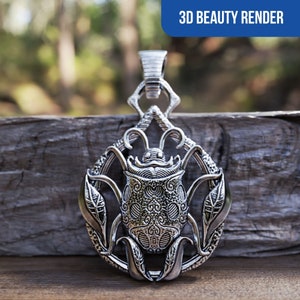 May include: A silver pendant featuring a detailed beetle design with intricate floral accents. The pendant is suspended from a loop at the top and has a textured, ornate finish.