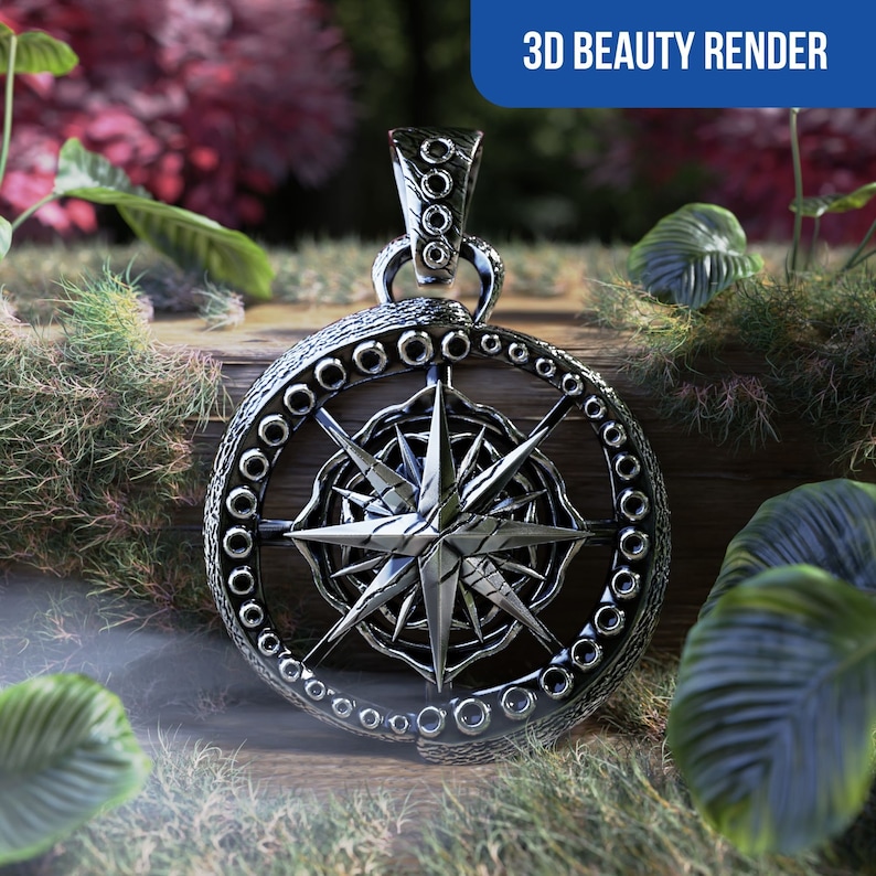 Peut inclure: Pendentif argent&eacute; avec un motif de rose des vents. Le pendentif pr&eacute;sente une surface textur&eacute;e et un cadre circulaire orn&eacute; de petits &eacute;l&eacute;ments d&eacute;coratifs. Le texte "3D BEAUTY RENDER" est en haut &agrave; droite. Le pendentif est pos&eacute; sur une surface en bois.