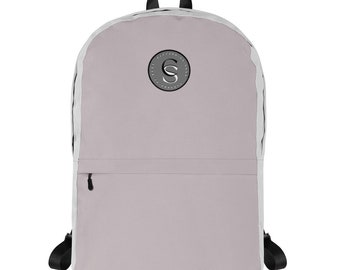 May include: A light purple backpack with a black zipper and a black and white logo on the front. The logo is a circle with the letter "S" in the centre.