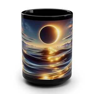 May include: Black ceramic mug with a colorful image of a solar eclipse reflected in the water. The eclipse is a ring of fire with a dark center.