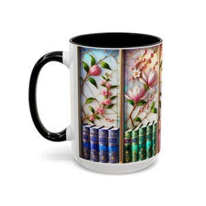 May include: White ceramic mug with a black handle and interior. The mug features a stained-glass design with pink flowers, green leaves, and a stack of books. The design wraps around the mug.