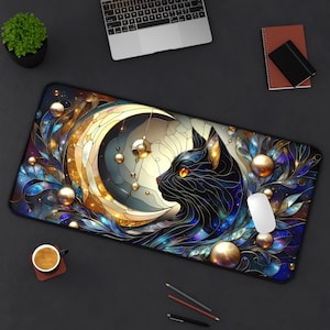 May include: A rectangular mouse pad featuring a black cat silhouette with orange eyes, set against a stained-glass style crescent moon and gold orbs. The design incorporates blue, gold, and purple hues, creating a celestial theme.
