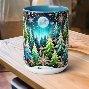 May include: A ceramic mug featuring a winter forest scene. The design includes green and blue fir trees, snowflakes, and a full moon against a dark blue sky. The mug has a white base and a blue interior.