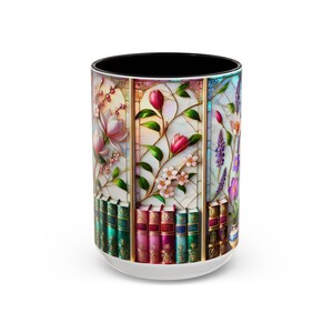 May include: A white ceramic mug with a black interior and a wraparound floral design. The design features three vertical panels with flowers and books. The flowers include pink magnolias, red tulips, and purple lavender. The books are in various colors.
