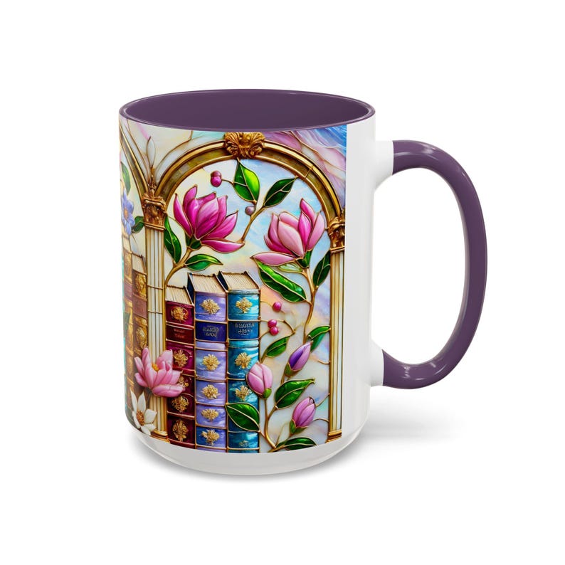 May include: White ceramic mug with a purple interior and handle. The mug features a stained-glass design of pink magnolia flowers, books, and a gold arched window frame. The design is set against a light blue and pink background.