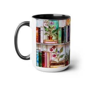 May include: White ceramic mug with a black handle and interior. The mug features a colourful illustration of a bookshelf with books and potted plants. The design has a stained-glass effect, with vibrant colours.
