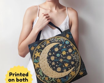 May include: A black tote bag with a colorful embroidered design of a crescent moon and stars. The bag is held by a woman wearing a white tank top.