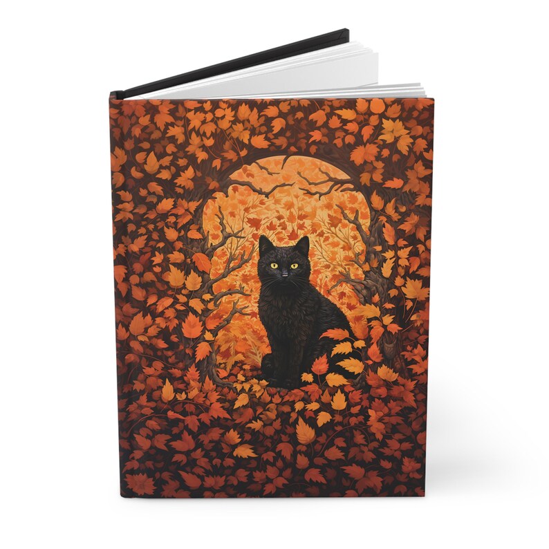 May include: A black cat with yellow eyes sits in a circle of orange and brown leaves. The cat is looking directly at the viewer. The background is a dark orange and brown colour.