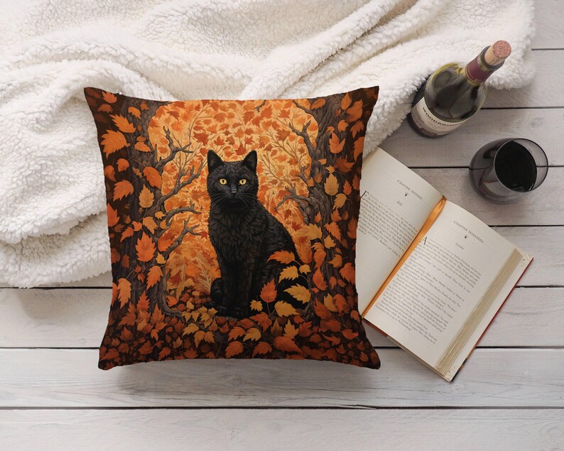 May include: A black cat with yellow eyes sits in a pile of orange and brown autumn leaves. The cat is looking directly at the viewer. The background is a dark forest.