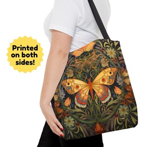 This beautiful tote bag features a brilliantly colored and highly detailed butterfly surrounded by flowers and foliage. The butterfly is yellow, red, pink, blue, gray, and brown.  The flowers and print reflect the similar colors, all on a black  back