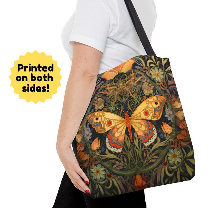 This beautiful tote bag features a brilliantly colored and highly detailed butterfly surrounded by flowers and foliage. The butterfly is yellow, red, pink, blue, gray, and brown.  The flowers and print reflect the similar colors, all on a black  back
