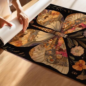 May include: A large, intricate butterfly with wings made of colorful floral patterns and textures on a black background.