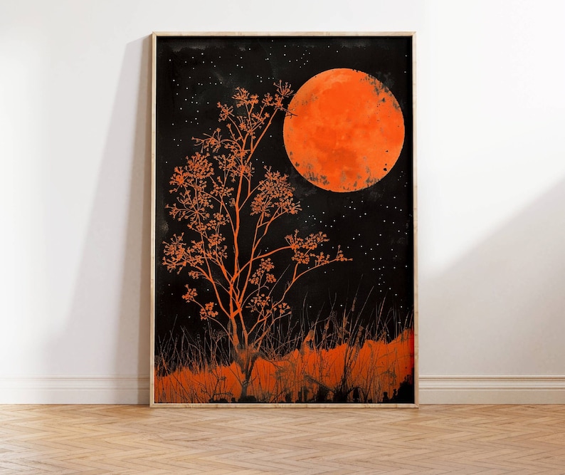 This gorgeous poster print features an illustration of an orange full moon above a matching orange tree, with orange grass  in the foreground. The sky is black and full of tiny stars.