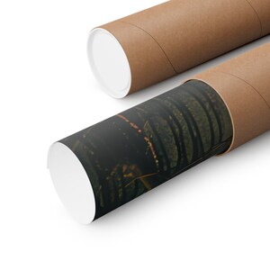 May include: A rolled up poster print with a dark green and black abstract design is inside a brown cardboard tube. The tube is partially unrolled, revealing the print.