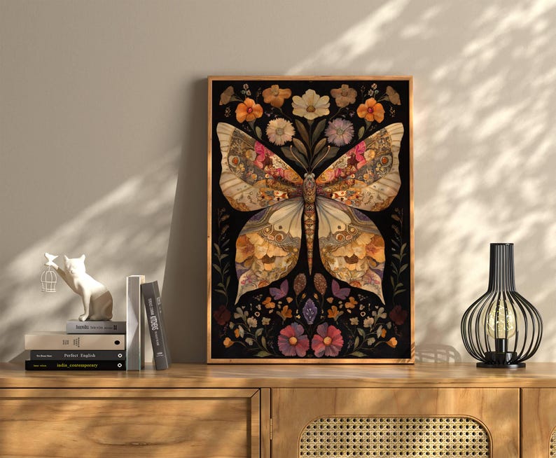 May include: A framed print of a butterfly with wings made of dried flowers and leaves on a black background. The butterfly is surrounded by smaller flowers and leaves.