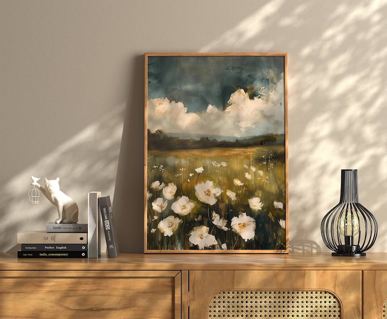 This gorgeous oil painting poster print features white flowers in a golden field.  The sky has some clouds and exudes a moody atmosphere.