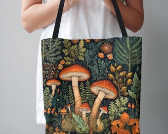 May include: A black tote bag with a colorful illustration of mushrooms and foliage. The mushrooms are red and orange with white spots. The foliage is green and brown.