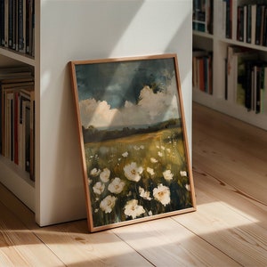 May include: A framed painting of a field of white flowers with a blue sky and white clouds in the background.
