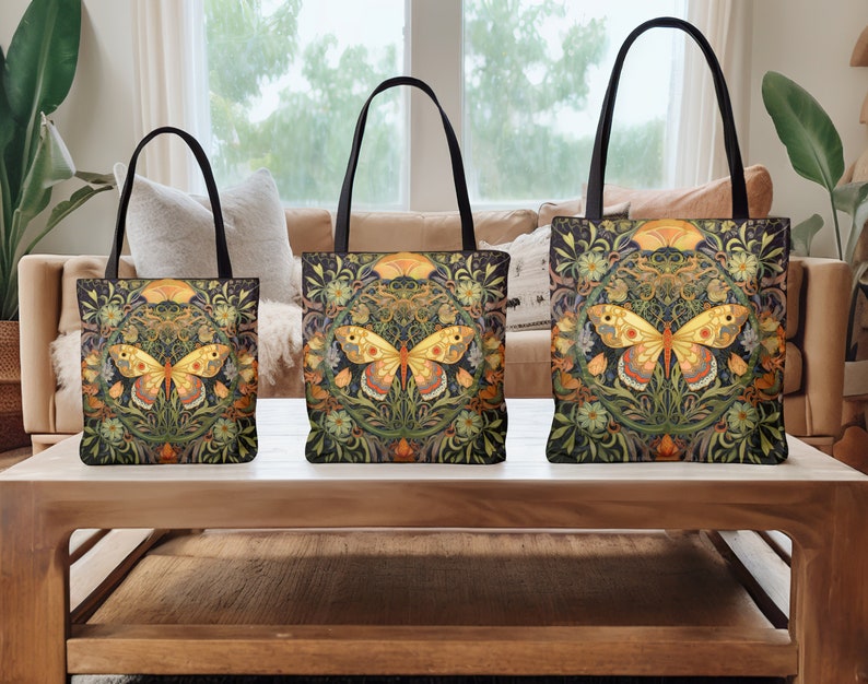 May include: Three tote bags with black handles and a floral pattern featuring a yellow butterfly. The bags are arranged in size order from smallest to largest on a wooden table.