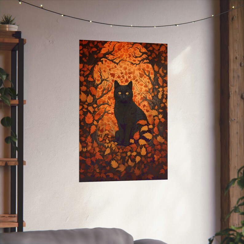 May include: A black cat with yellow eyes sits in a forest of orange and brown leaves. The cat is looking directly at the viewer.
