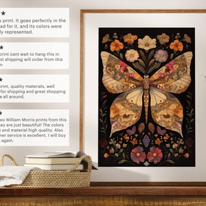 May include: A framed print of a butterfly with intricate details made from pressed flowers and leaves. The butterfly is set against a black background and surrounded by a border of flowers. The print is in a light wood frame.