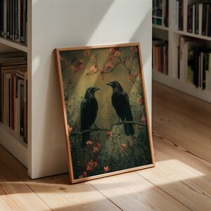 May include: A framed print of two black ravens perched on branches with pink blossoms. The background is a soft green and yellow.