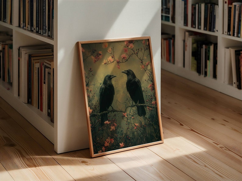 May include: A framed print of two black ravens perched on branches with pink blossoms. The background is a soft green and yellow.