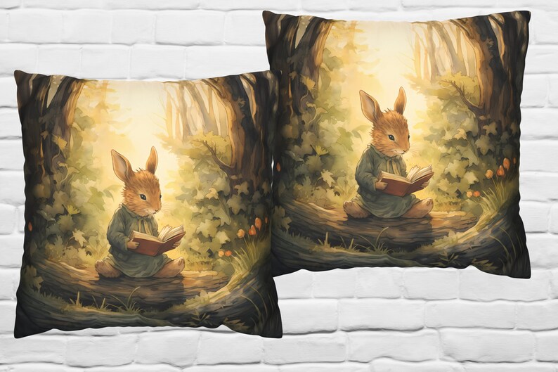 May include: Two throw pillows with a woodland scene featuring a brown rabbit reading a book in a forest setting. The pillows have a soft, muted color palette with shades of brown, green, and yellow.