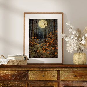May include: A framed print of a moonlit forest scene with a path leading through the trees. The trees are dark green and the moon is a bright yellow. There are orange mushrooms growing along the path.