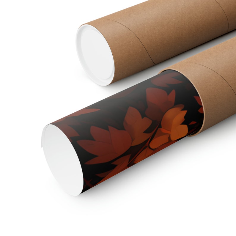 May include: A brown cardboard tube with a white end cap. The tube is partially unrolled, revealing a print of dark red and orange leaves on a black background.