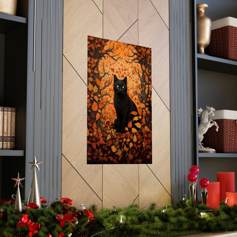 May include: A black cat with yellow eyes sits in a forest of orange and brown leaves. The cat is looking directly at the viewer.